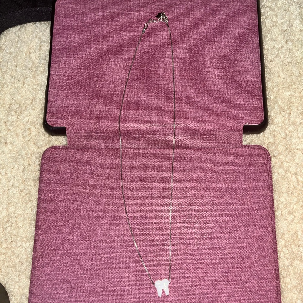 Silver tooth necklace